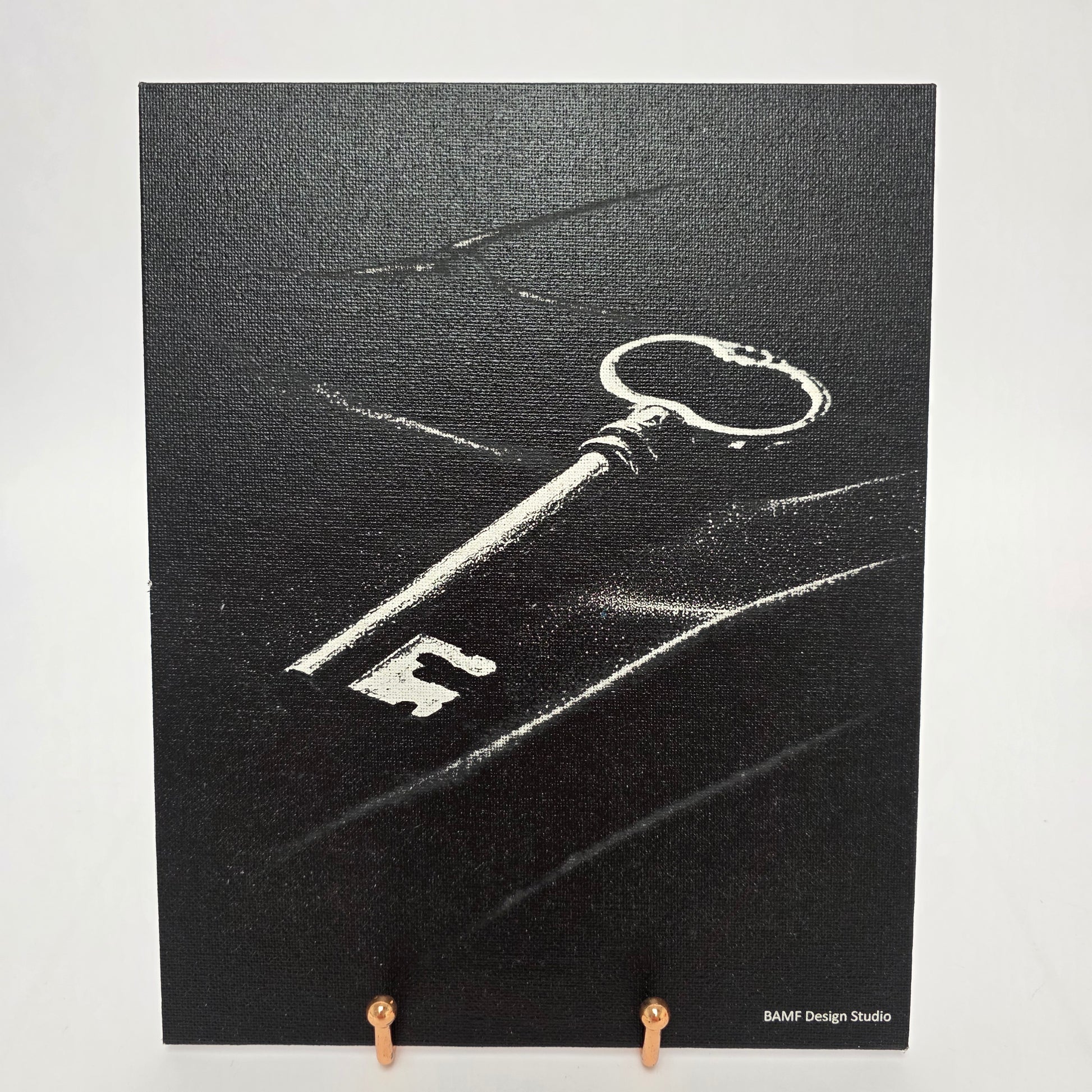 Canvas print of a vintage key. Black and white accents.