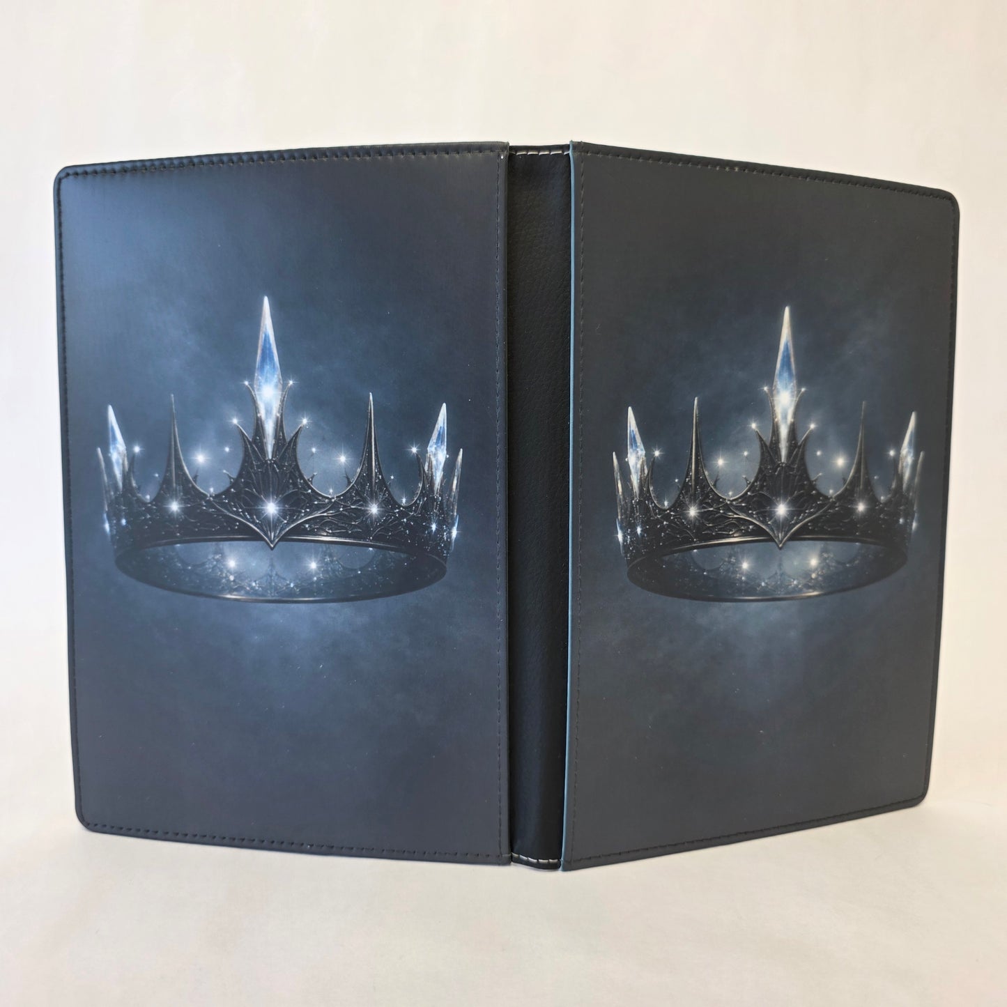 Journal cover with a floating metal crown donned with crystals. Image on front and back cover.