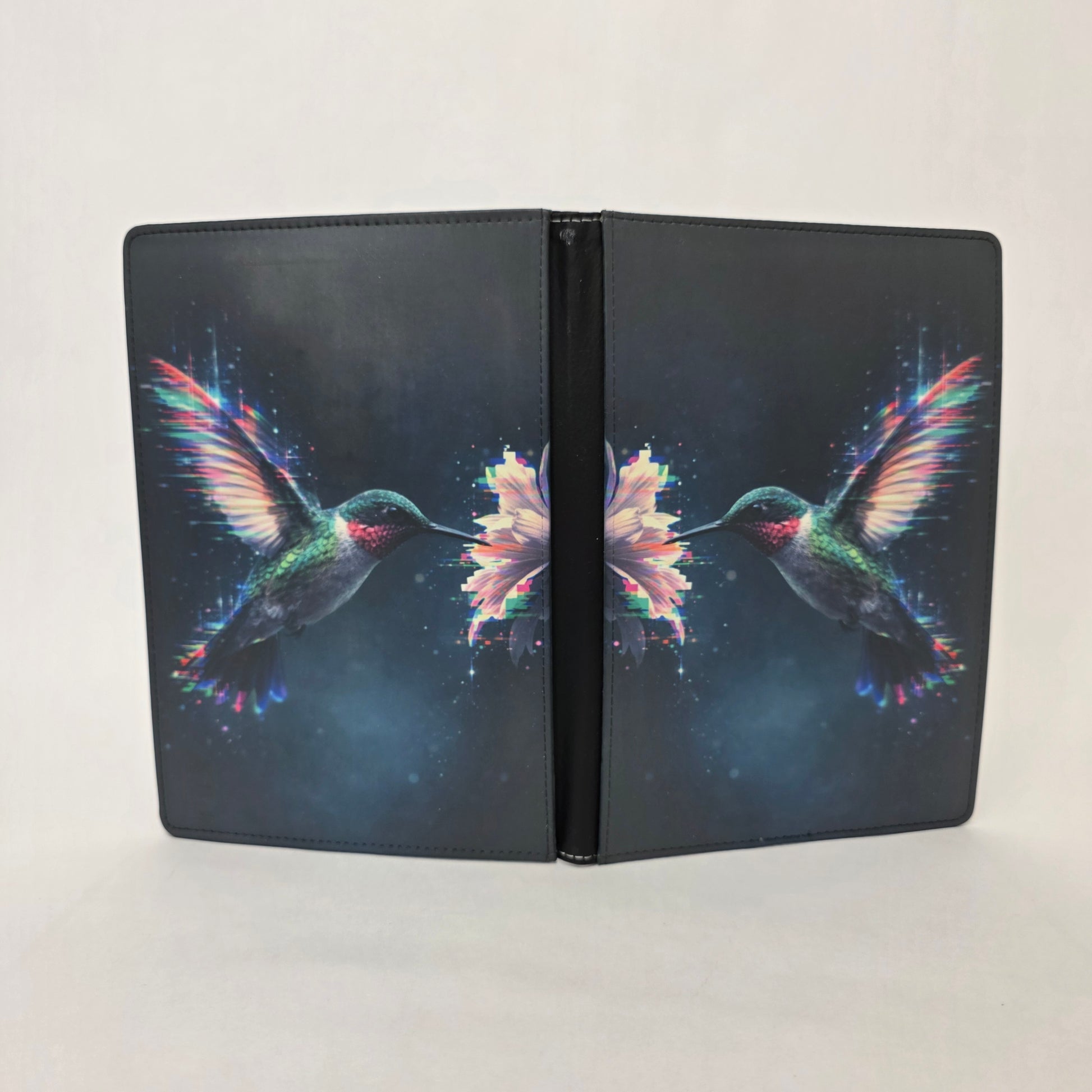 Faux leather journal cover with glowing hummingbird design on a white background