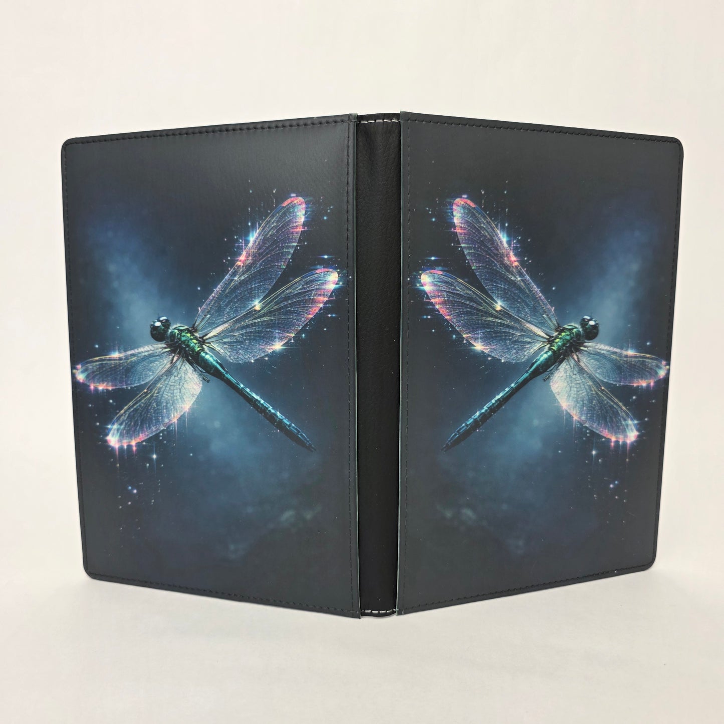 Faux leather journal with dragonfly image on front and back, with a white background.