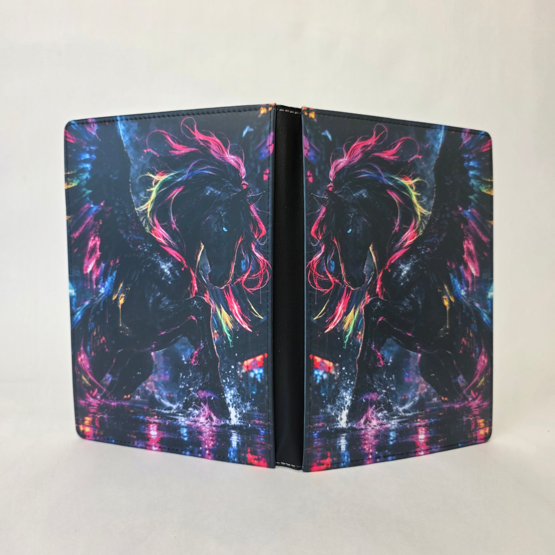 Colorful notebook cover with a silhouette design of a Pegasus on a white background