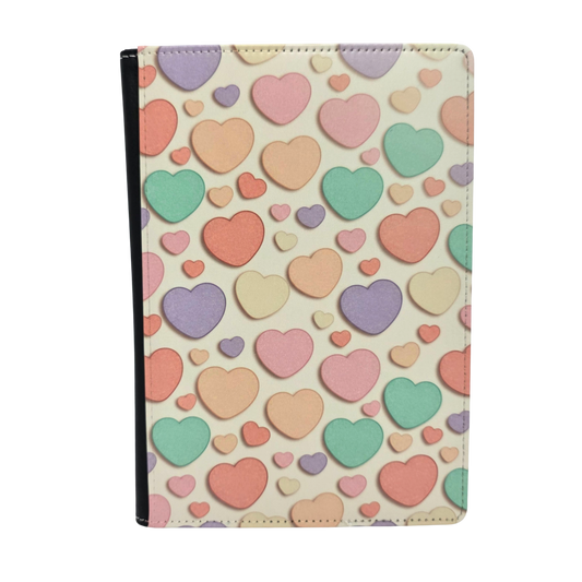 Journal cover with a colorful candy heart pattern in pastel colors on a light yellow background.