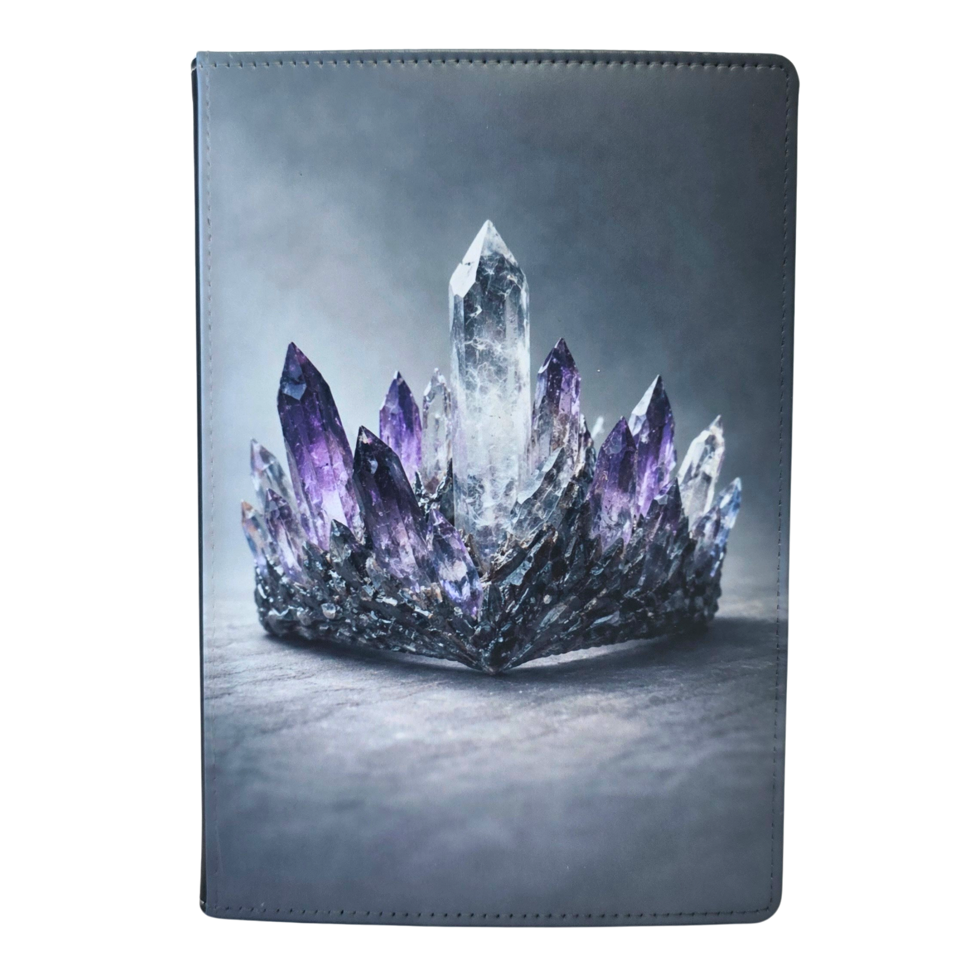 Journal cover with a crown design featuring clear and purple crystals.