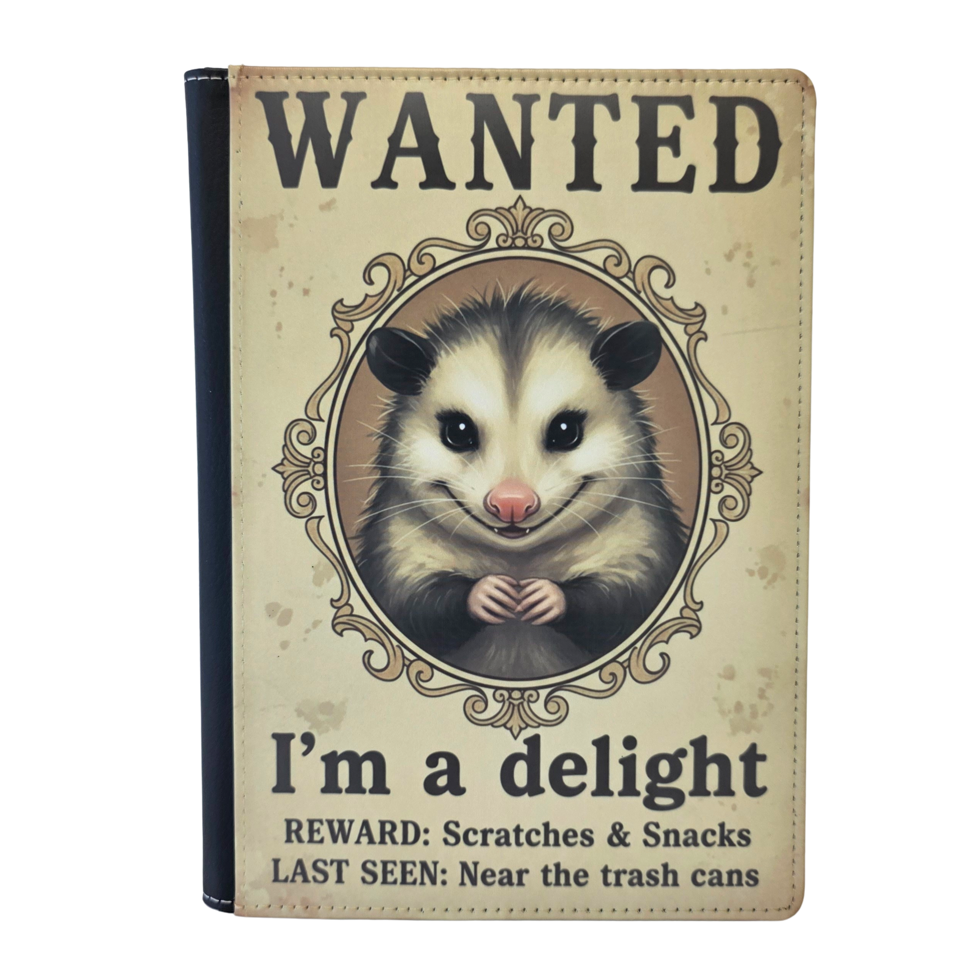 Notebook cover with an opossum illustration and 'Wanted' text on a beige background
