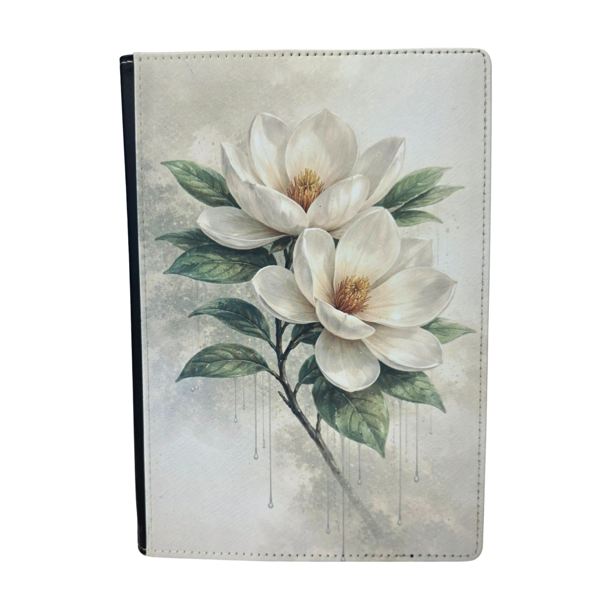 A journal cover with a white magnolia flower.