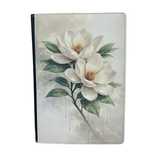 A journal cover with a white magnolia flower.
