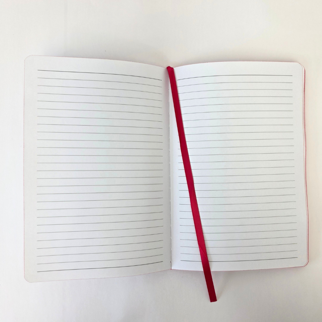 Open lined notebook with red bookmark on a white background